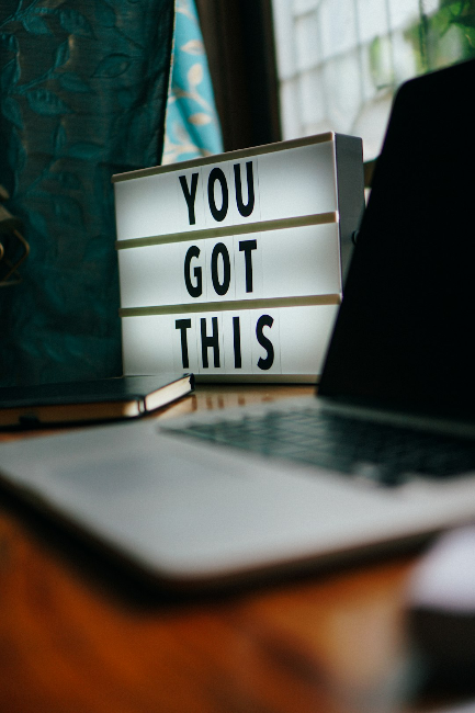 You got this sign by laptop on a table