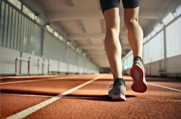 Man walking on an indoor track