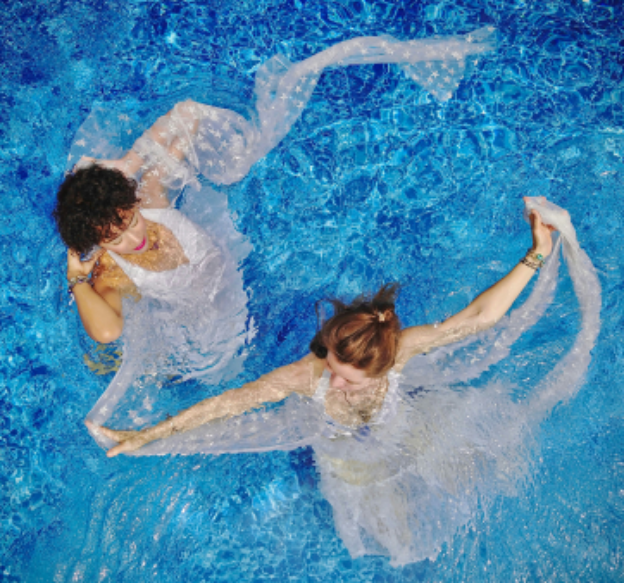 2 women doing water aerobics