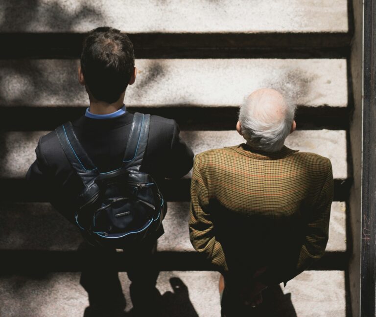 Young man and older man side by side